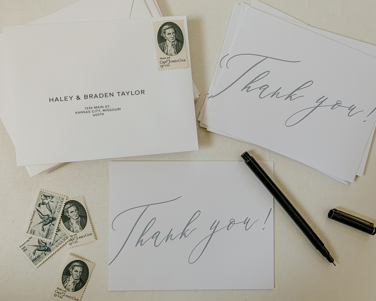 thank you cards, envelopes and stamps